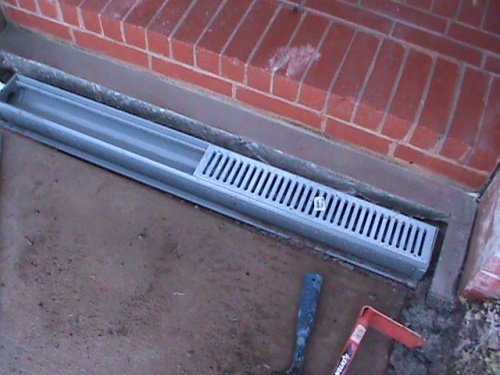 Channel Drain Installation in front of the front step.